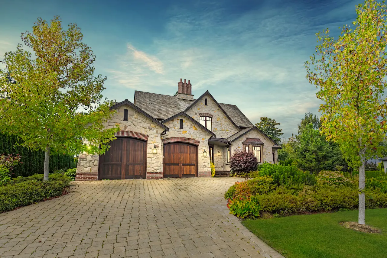 Large, gray brick luxury home in Potomac, Maryland